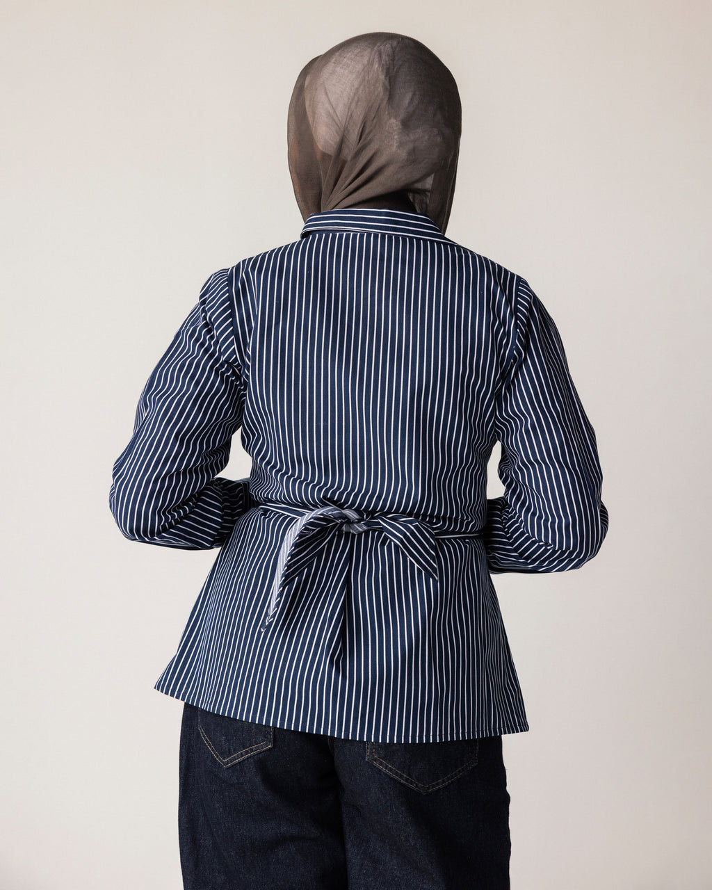 Striped shirt with a tie at the waist