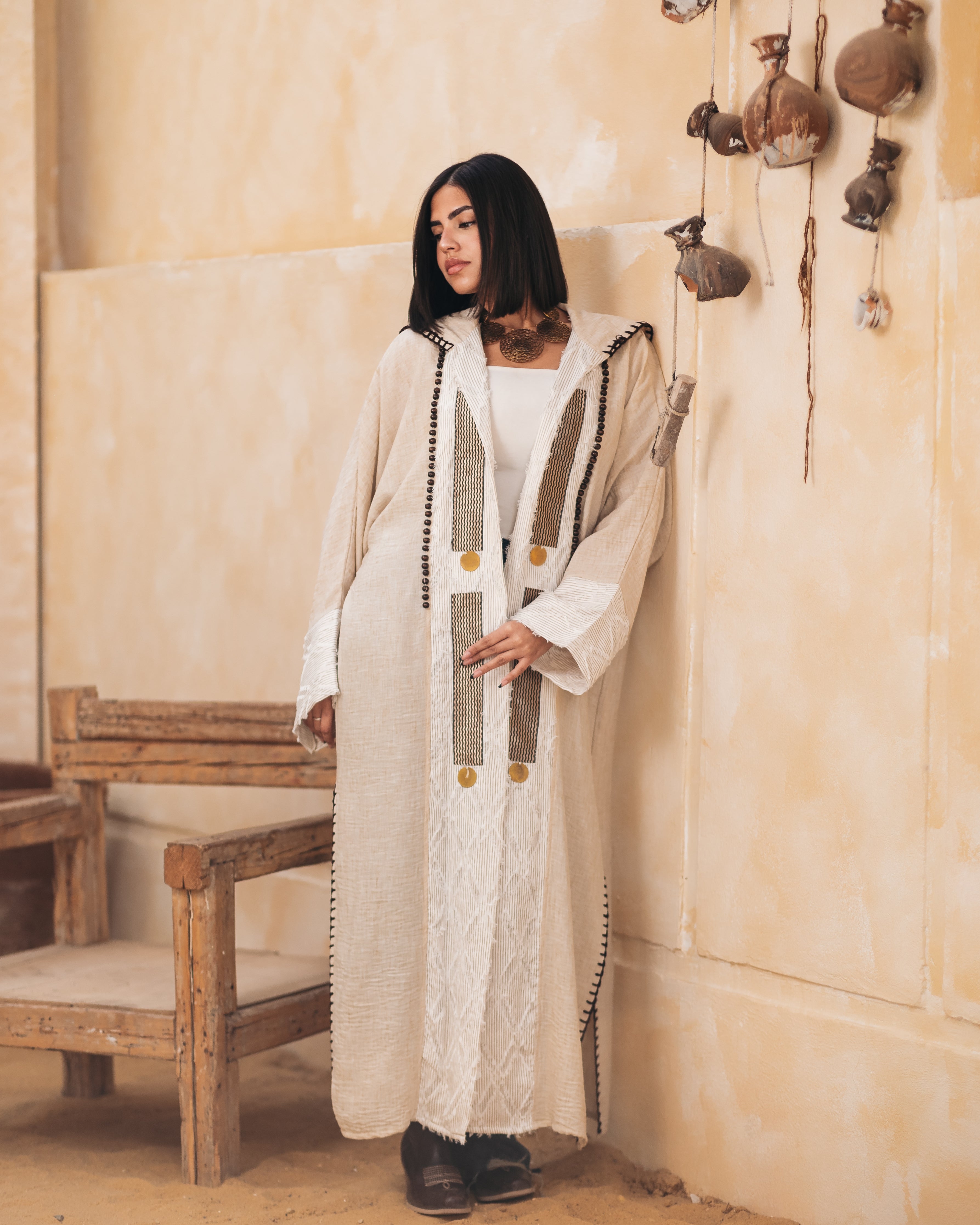 A hooded linen kaftan designed for comfort and style