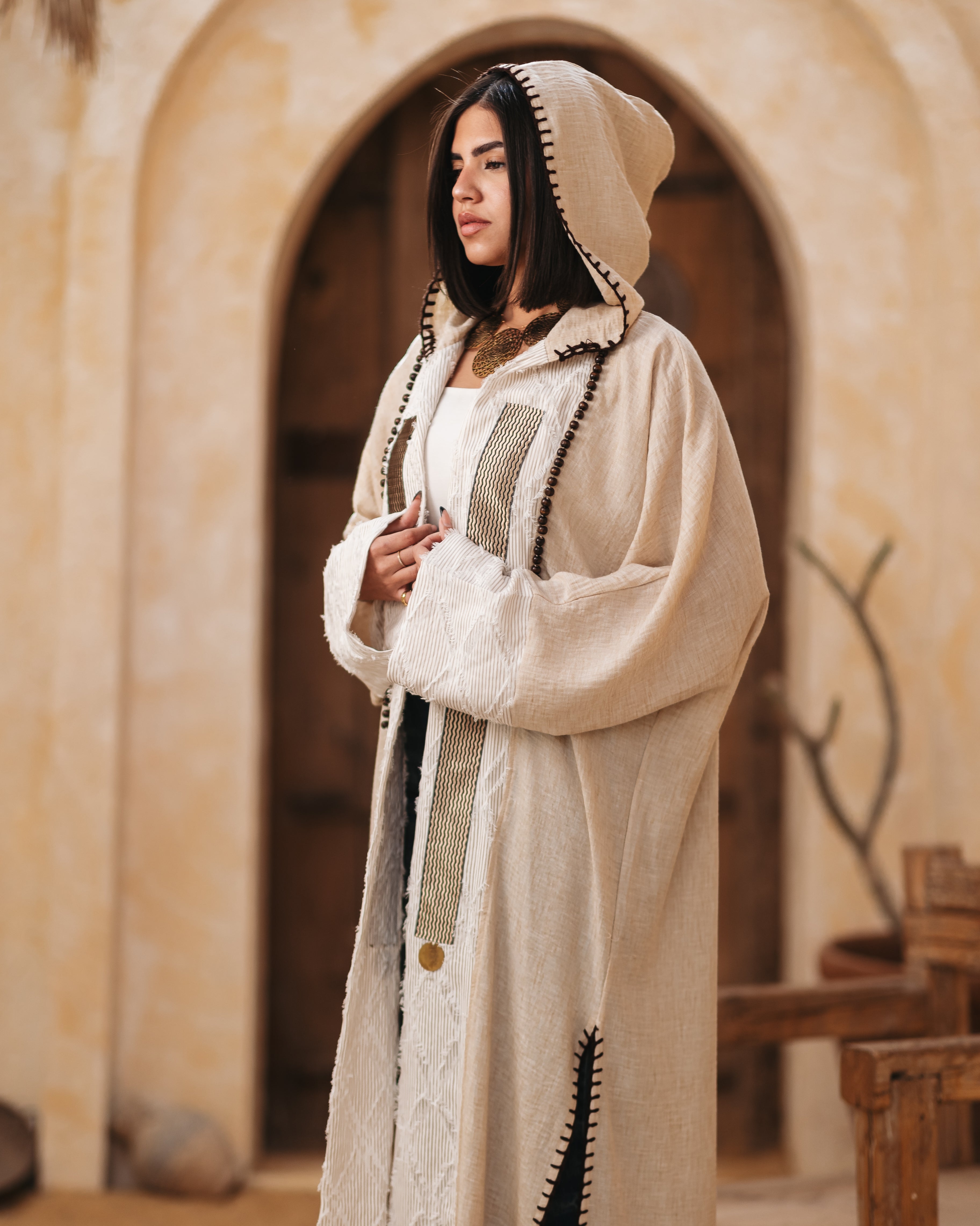 A hooded linen kaftan designed for comfort and style