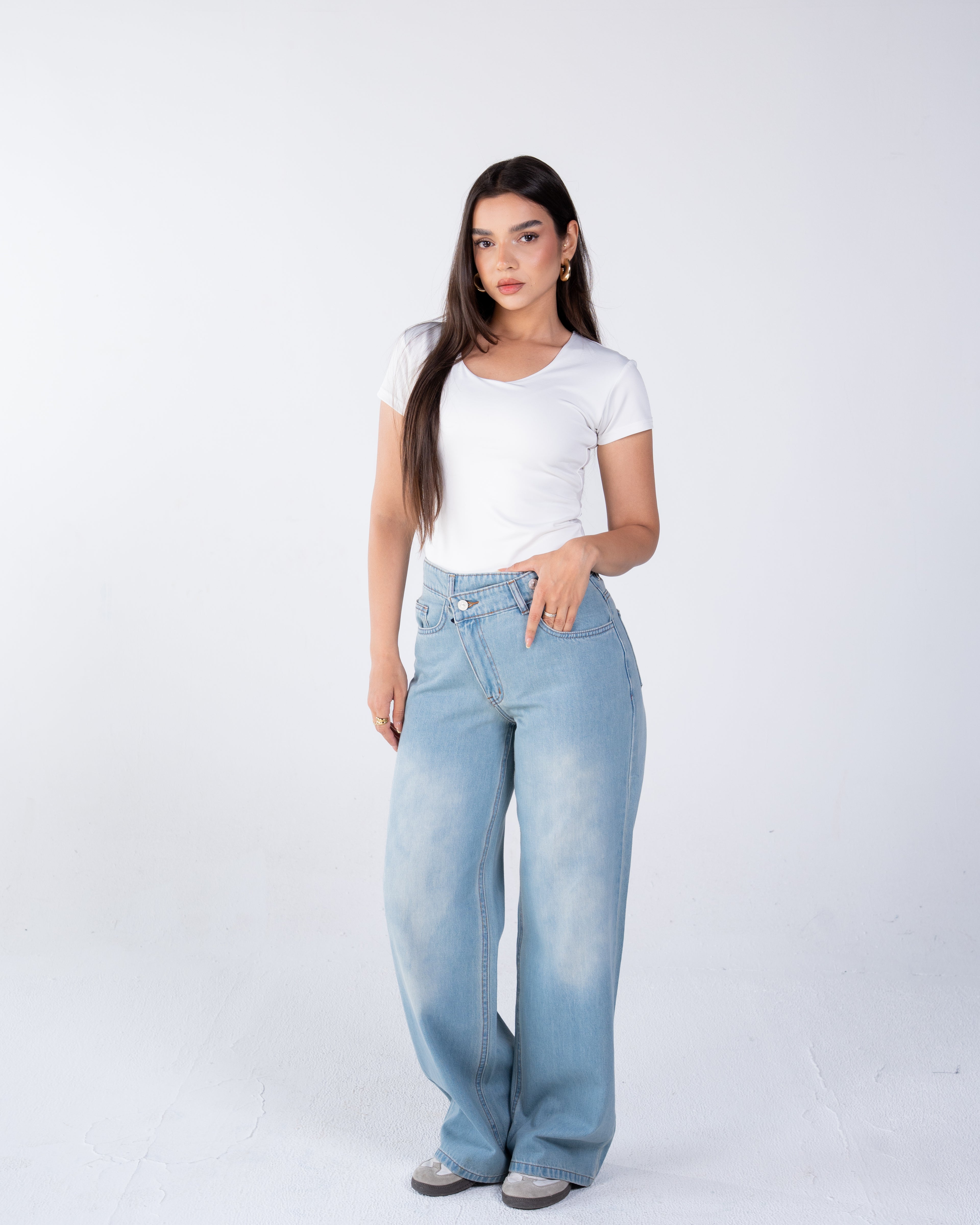 High-waist jeans asymmetric front zip and metal button fastening
