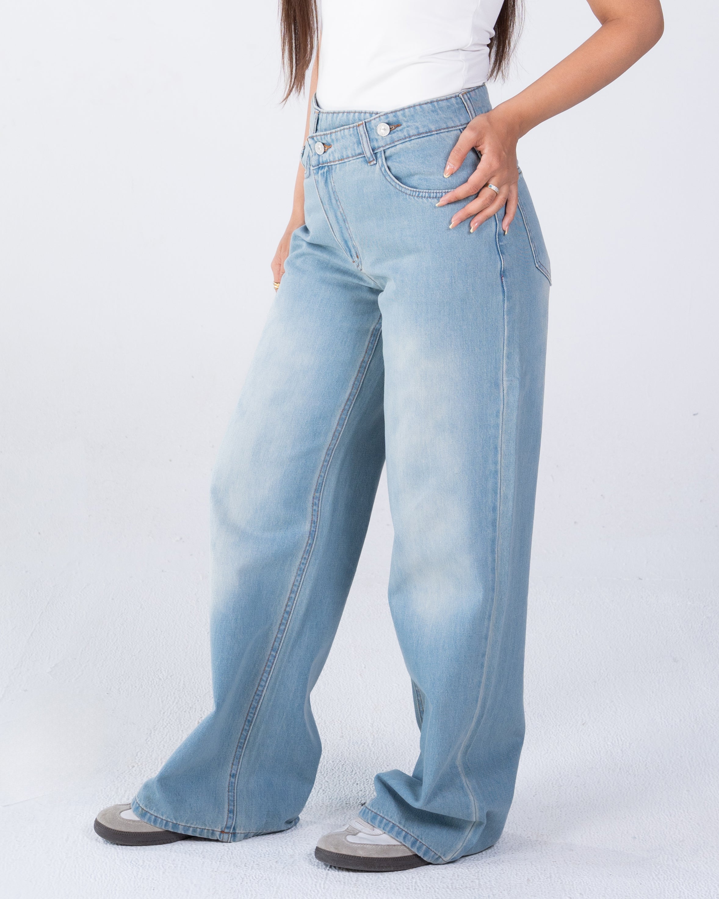 High-waist jeans asymmetric front zip and metal button fastening