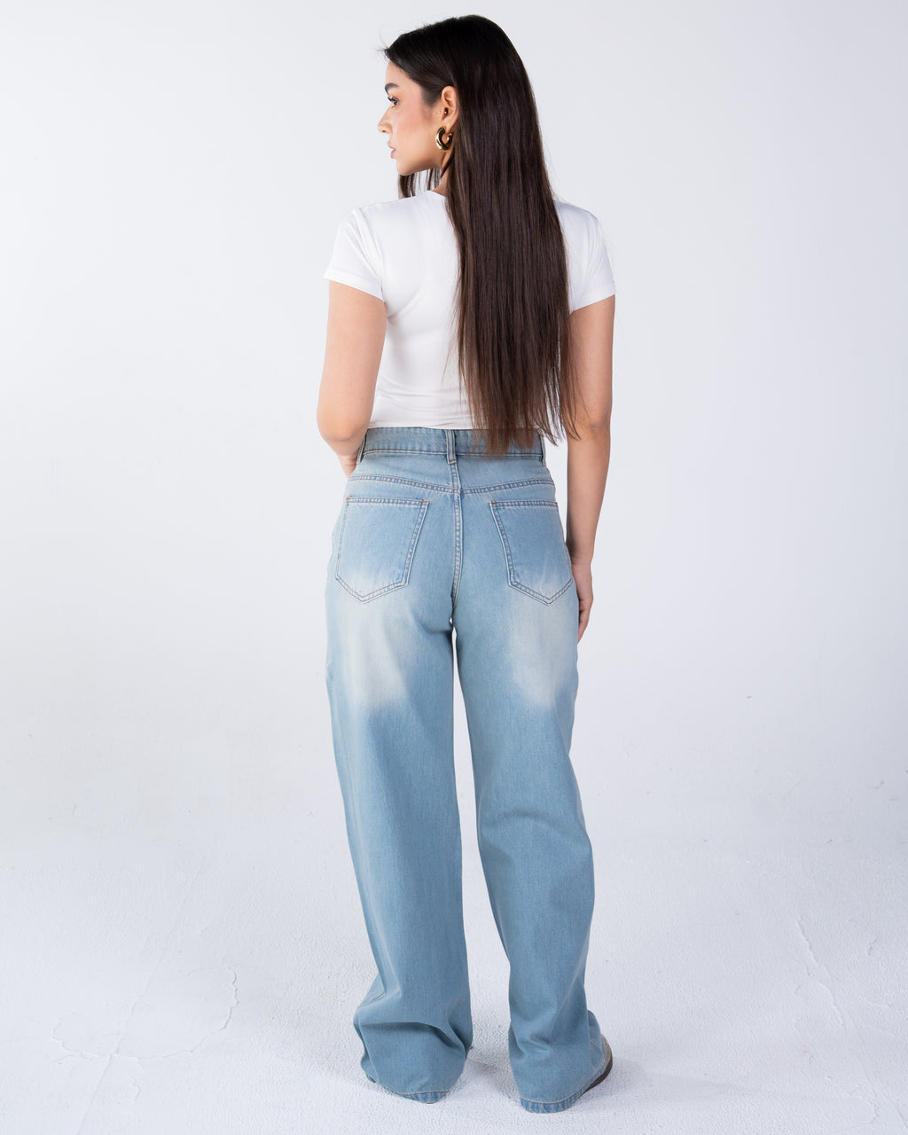 High-waist jeans asymmetric front zip and metal button fastening