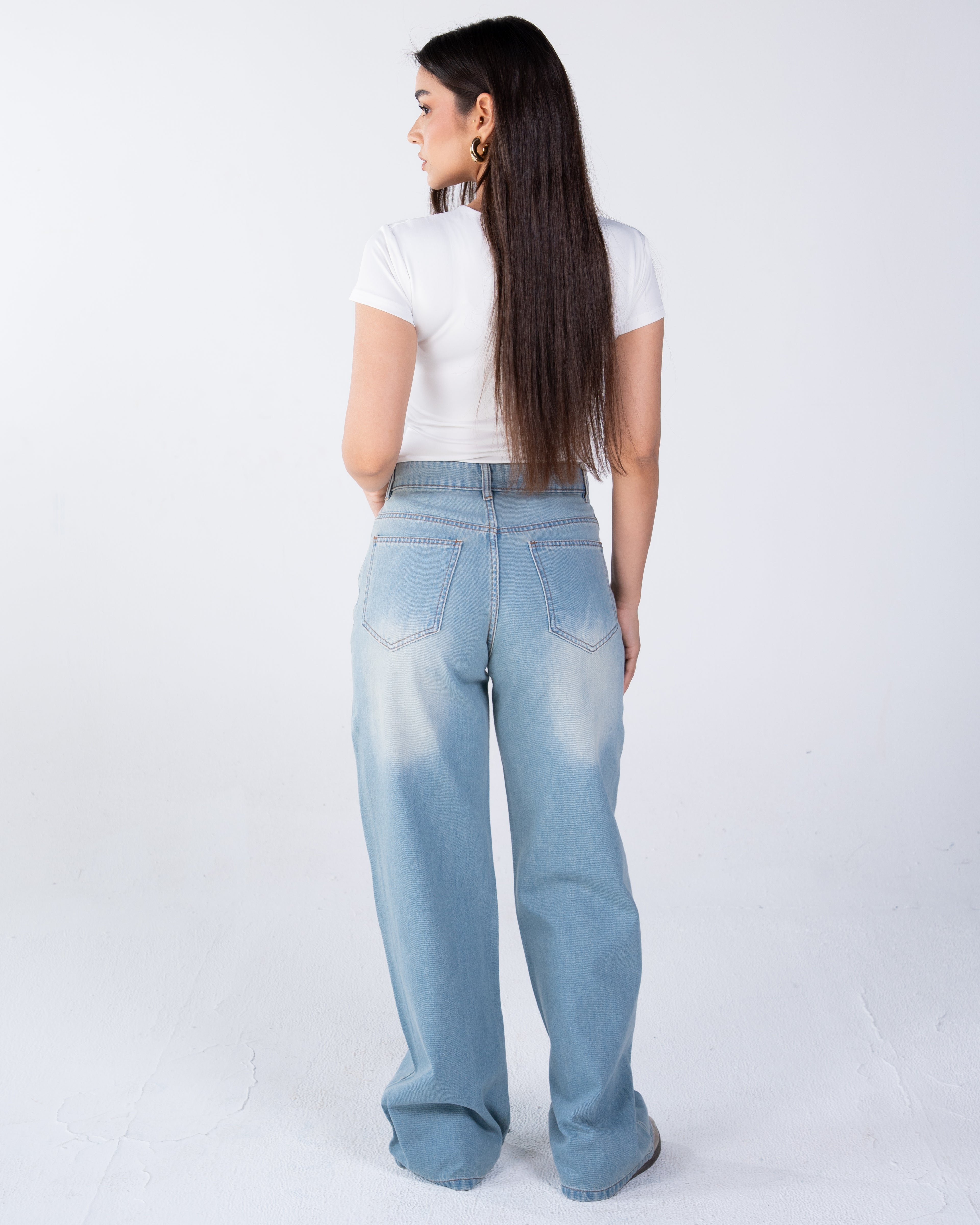 High-waist jeans asymmetric front zip and metal button fastening